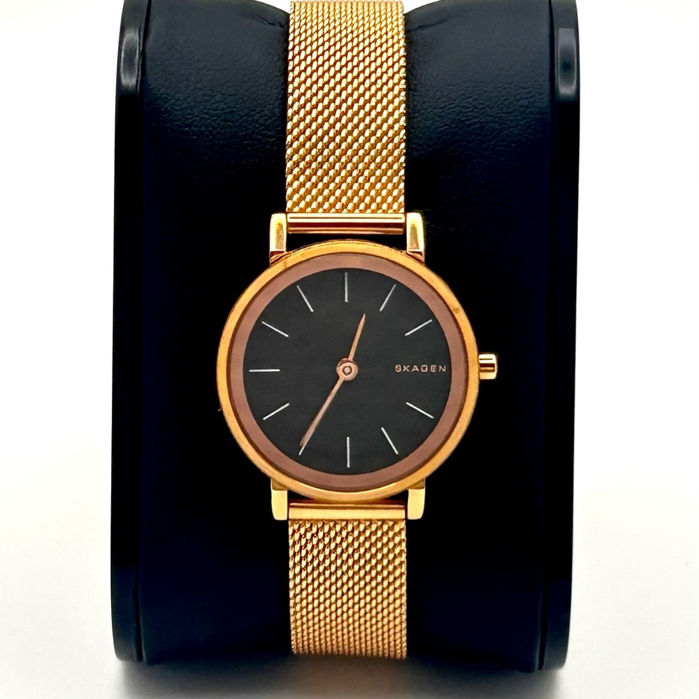 Skagen Watch gold tone, 26mm size case, 8in sizable wrist bracelet.
